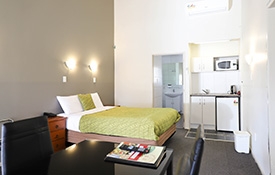 queen-size bed in the lounge area