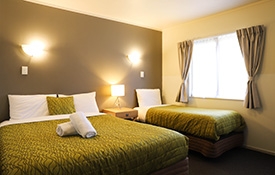 queen-size and single beds in the bedroom